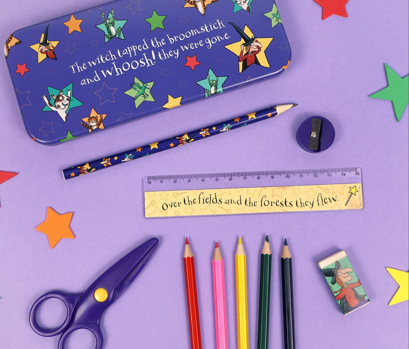 Colorful stationery items including a pencil case, pencils, scissors, and a ruler on a purple background with star decorations.